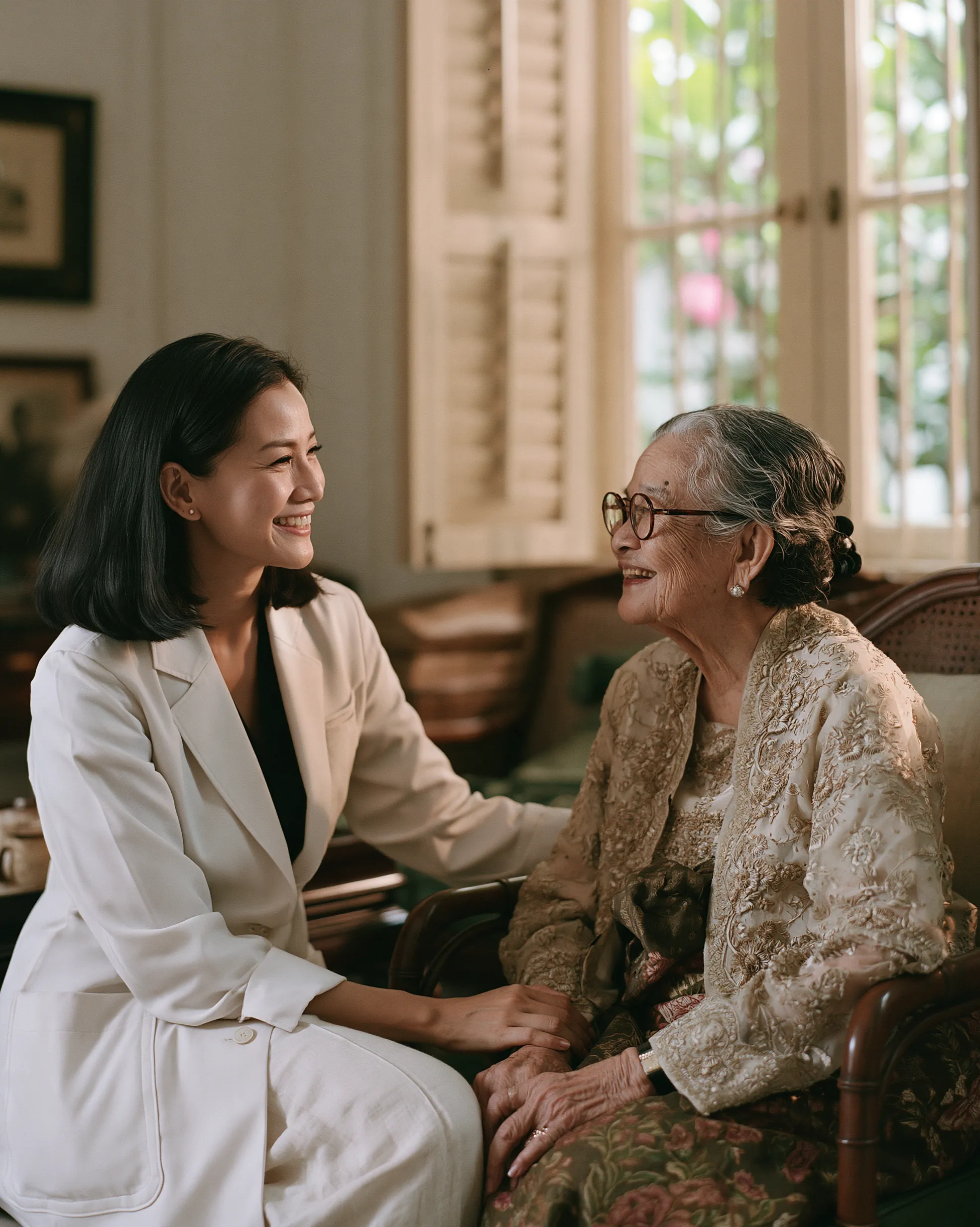 A clinician and an older patient smiling together