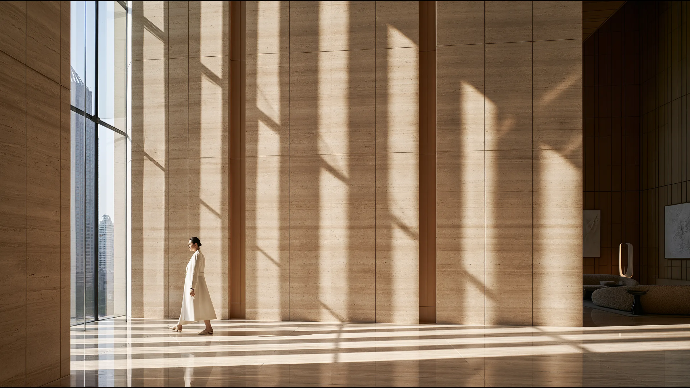 A clinician at ease in a vast, light-filled private clinic in Bangkok, the city beyond the glass