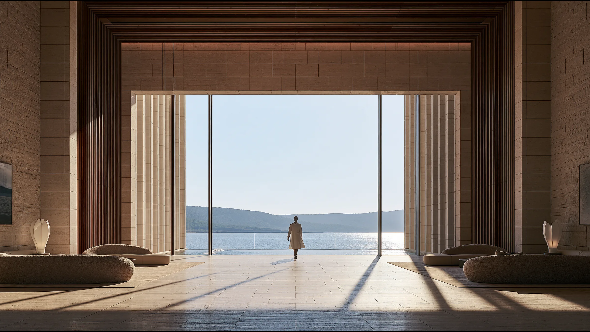 A clinician at ease in a vast, light-filled private clinic in Bodrum, the city beyond the glass