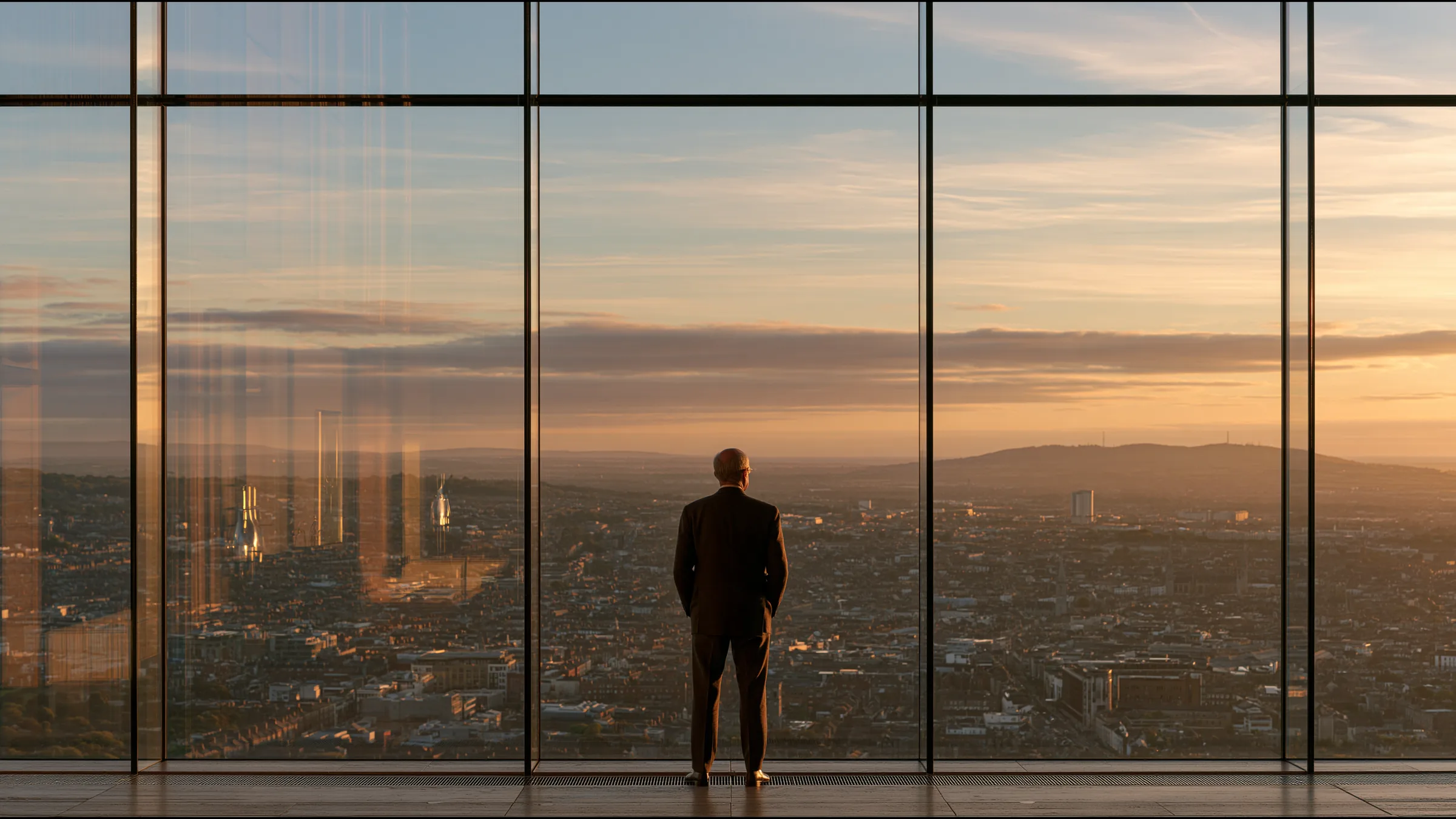 A clinician at ease in a vast, light-filled private clinic in Dublin, the city beyond the glass