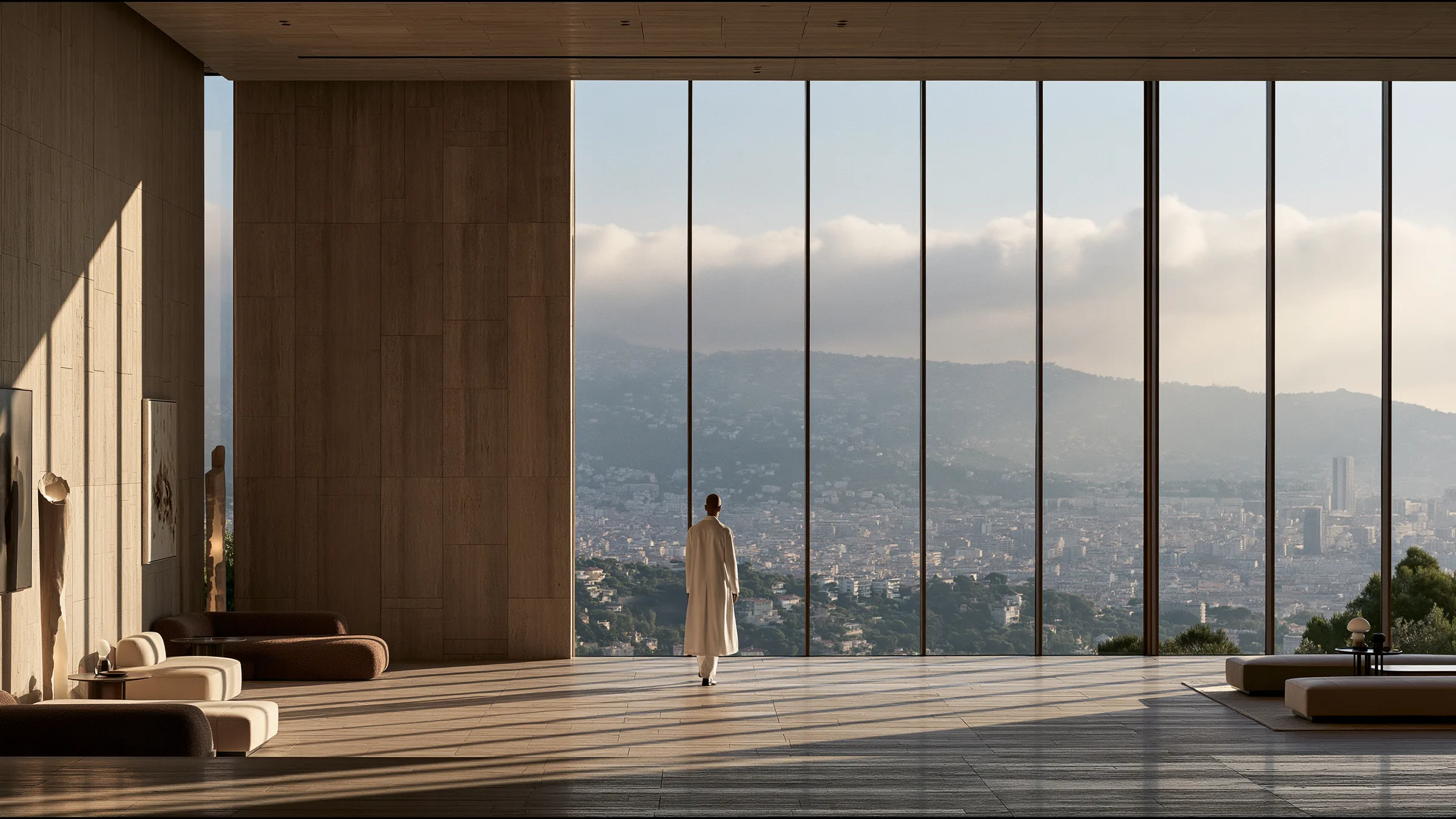 A clinician at ease in a vast, light-filled private clinic in Nice to Èze, the city beyond the glass