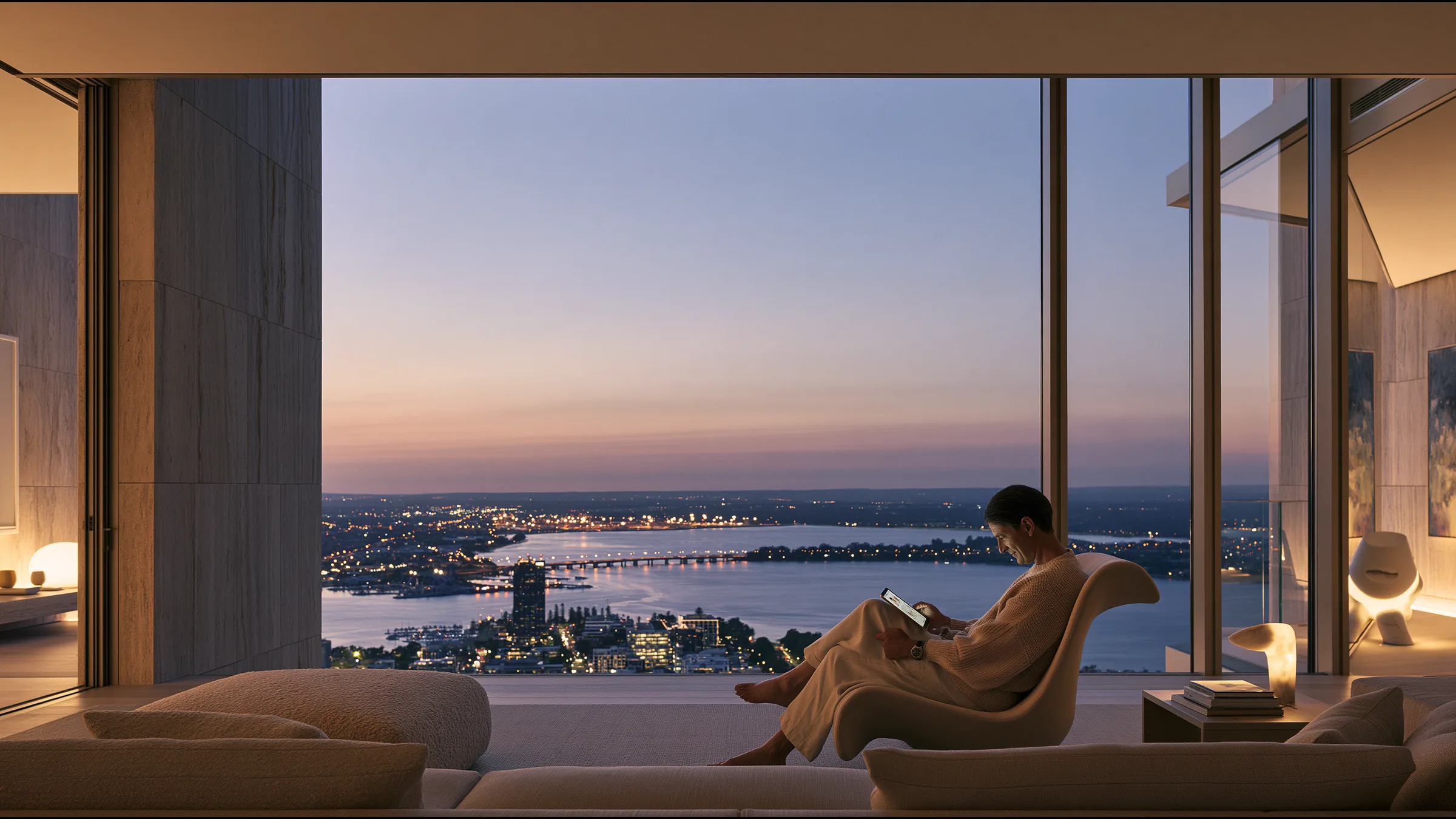A clinician at ease in a vast, light-filled private clinic in Perth, the city beyond the glass