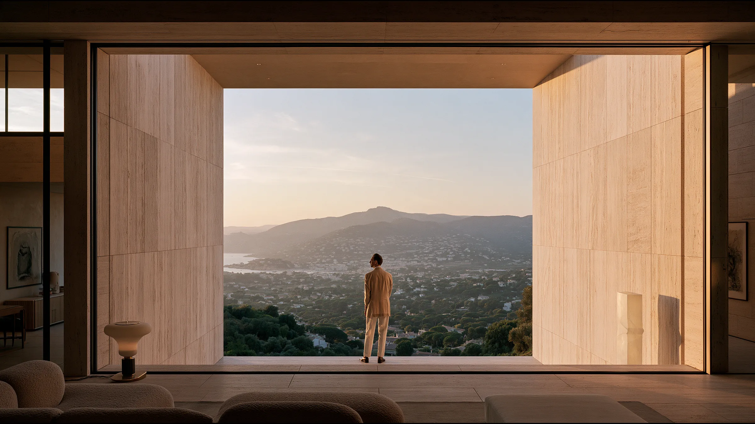 A clinician at ease in a vast, light-filled private clinic in Saint-Tropez, the city beyond the glass