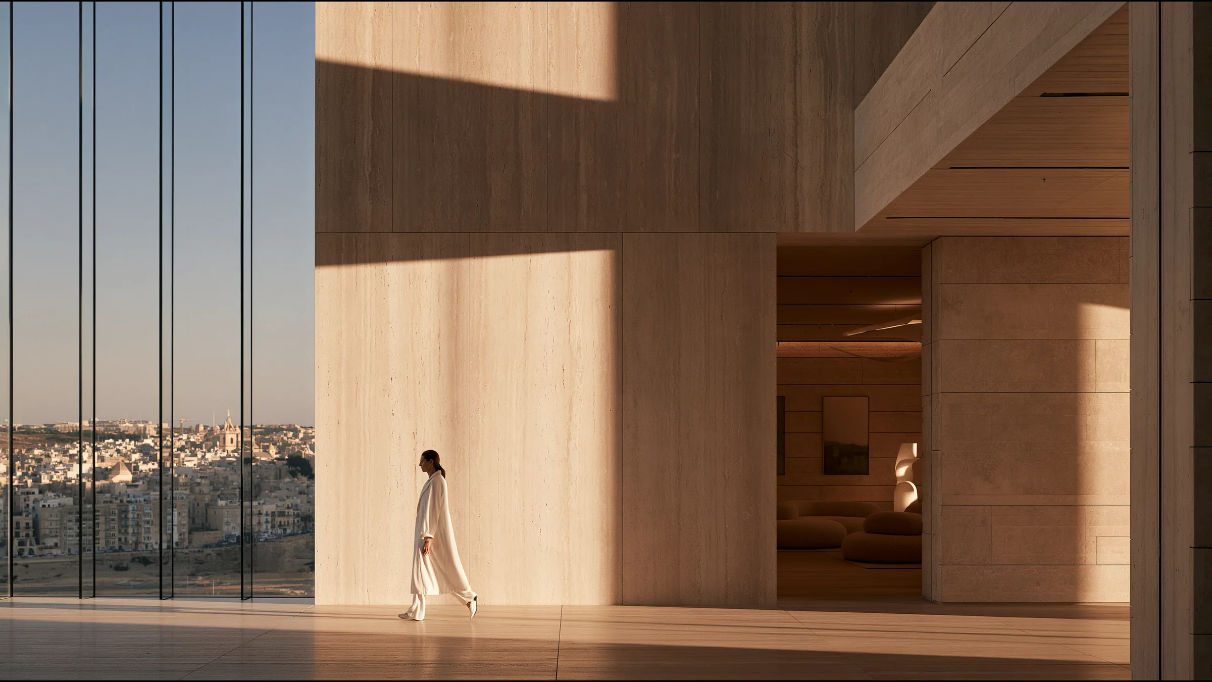 A clinician at ease in a vast, light-filled private clinic in St Julian's and Sliema, the city beyond the glass