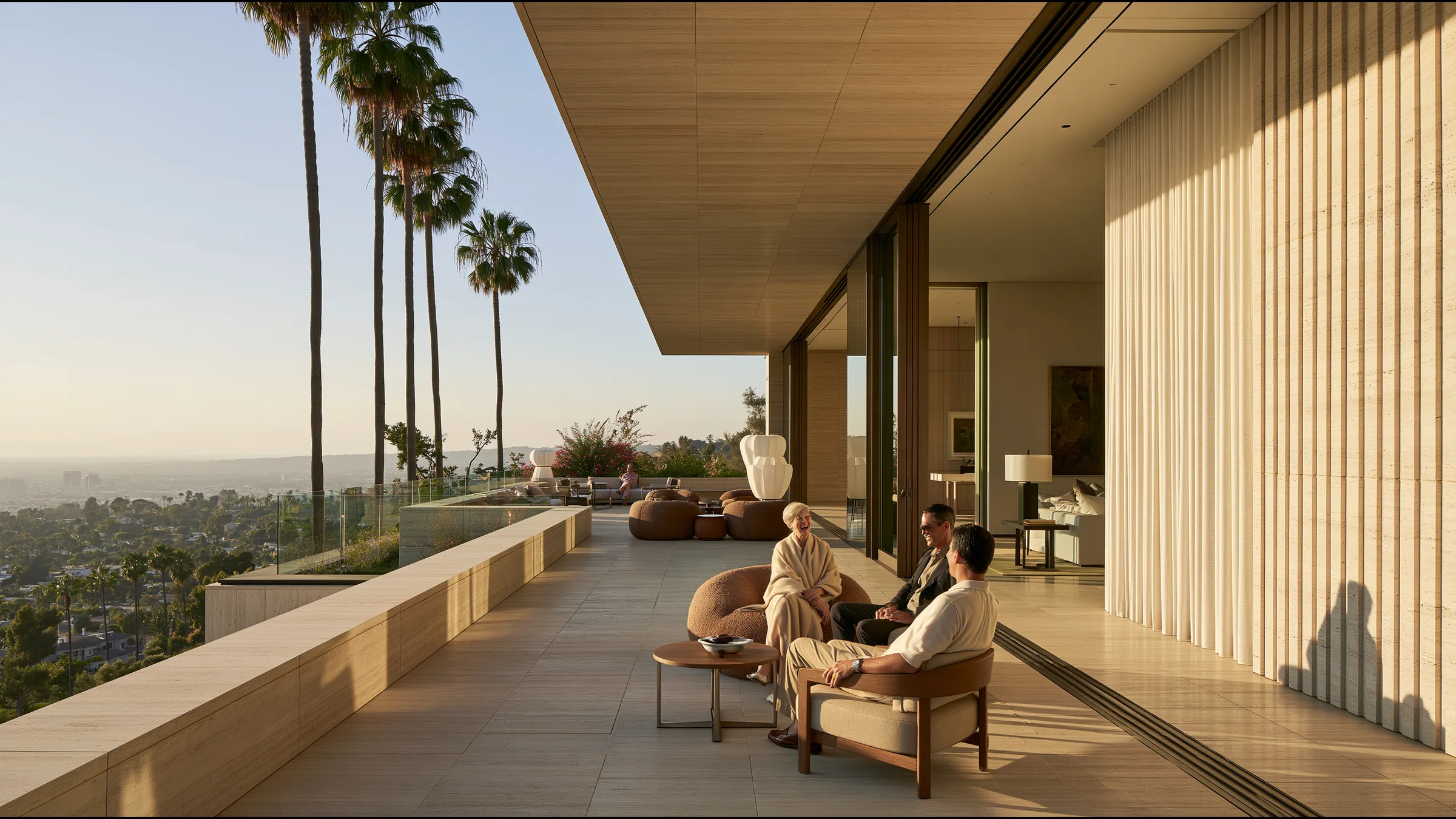 A woman in her sixties laughing with her physician on a sunlit stone terrace of a Beverly Hills clinic at the end of a check-up, palms and the city below
