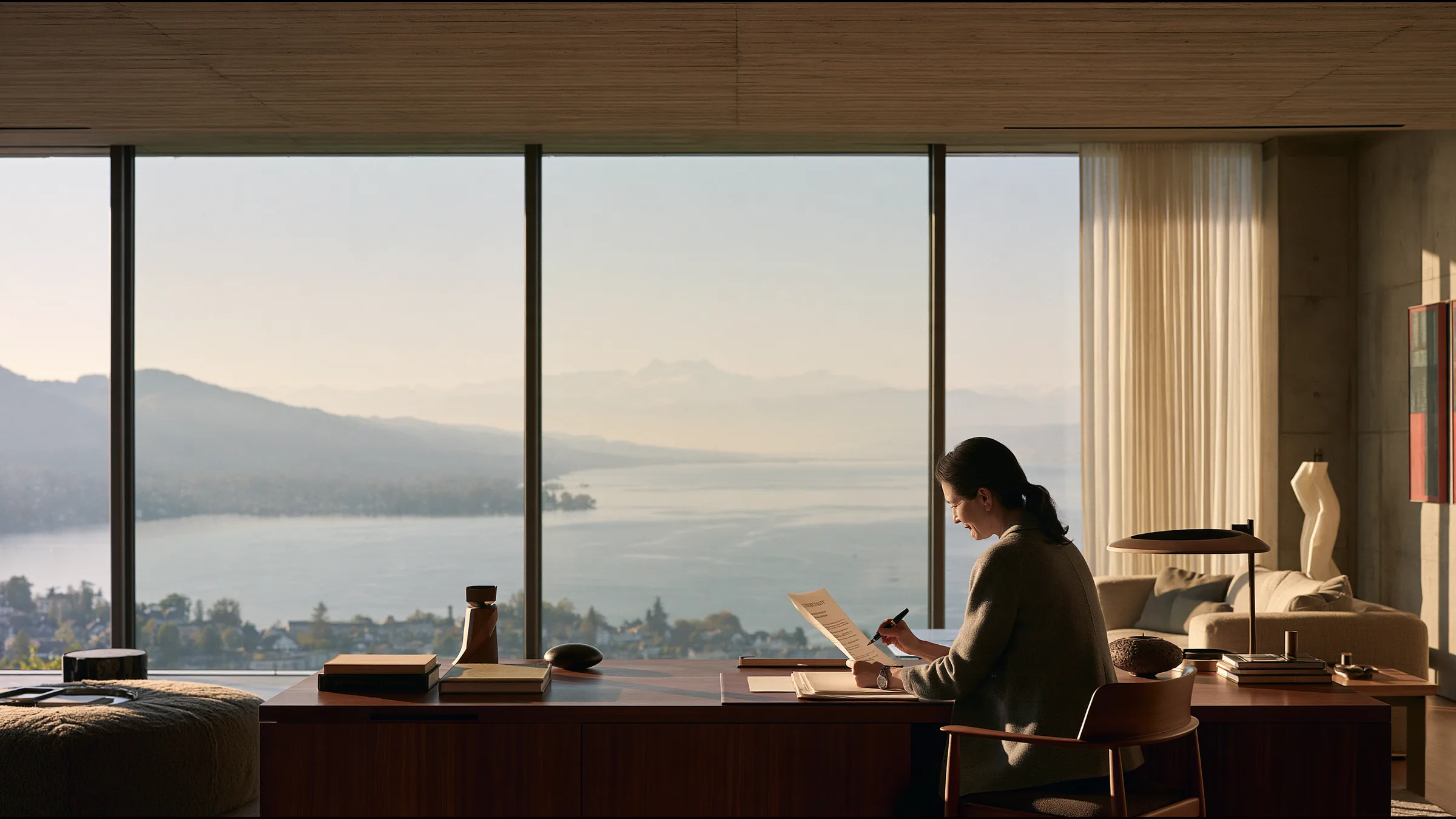 A clinic director in her late forties reading a contract at a walnut desk in a vast calm Zurich practice, a fountain pen in hand, the lake and the Alps through tall windows