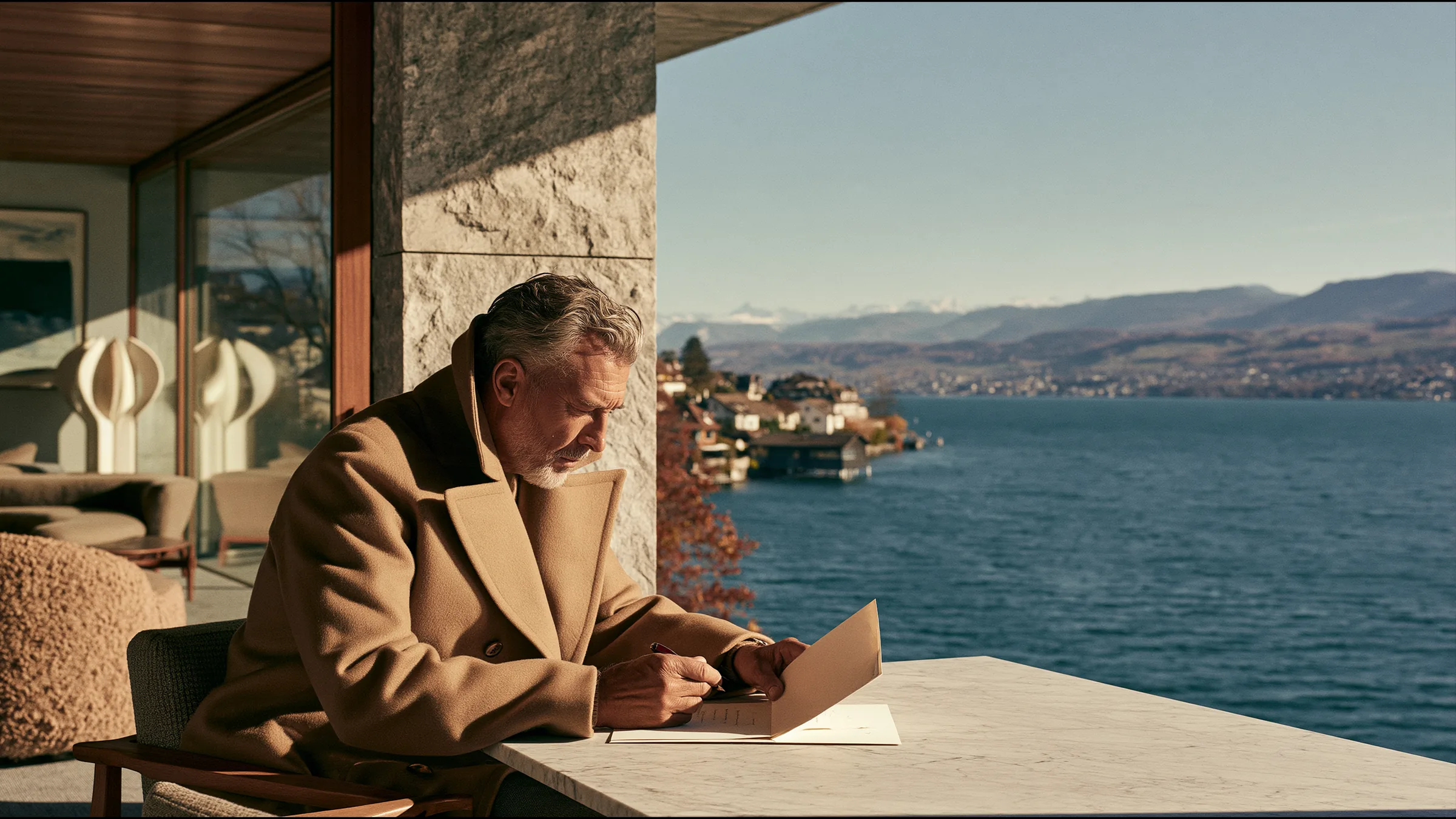 A man in his sixties at a marble table on a lakeside terrace in Zurich on an autumn morning, reading a single letter with a fountain pen, the lake and mountains beyond